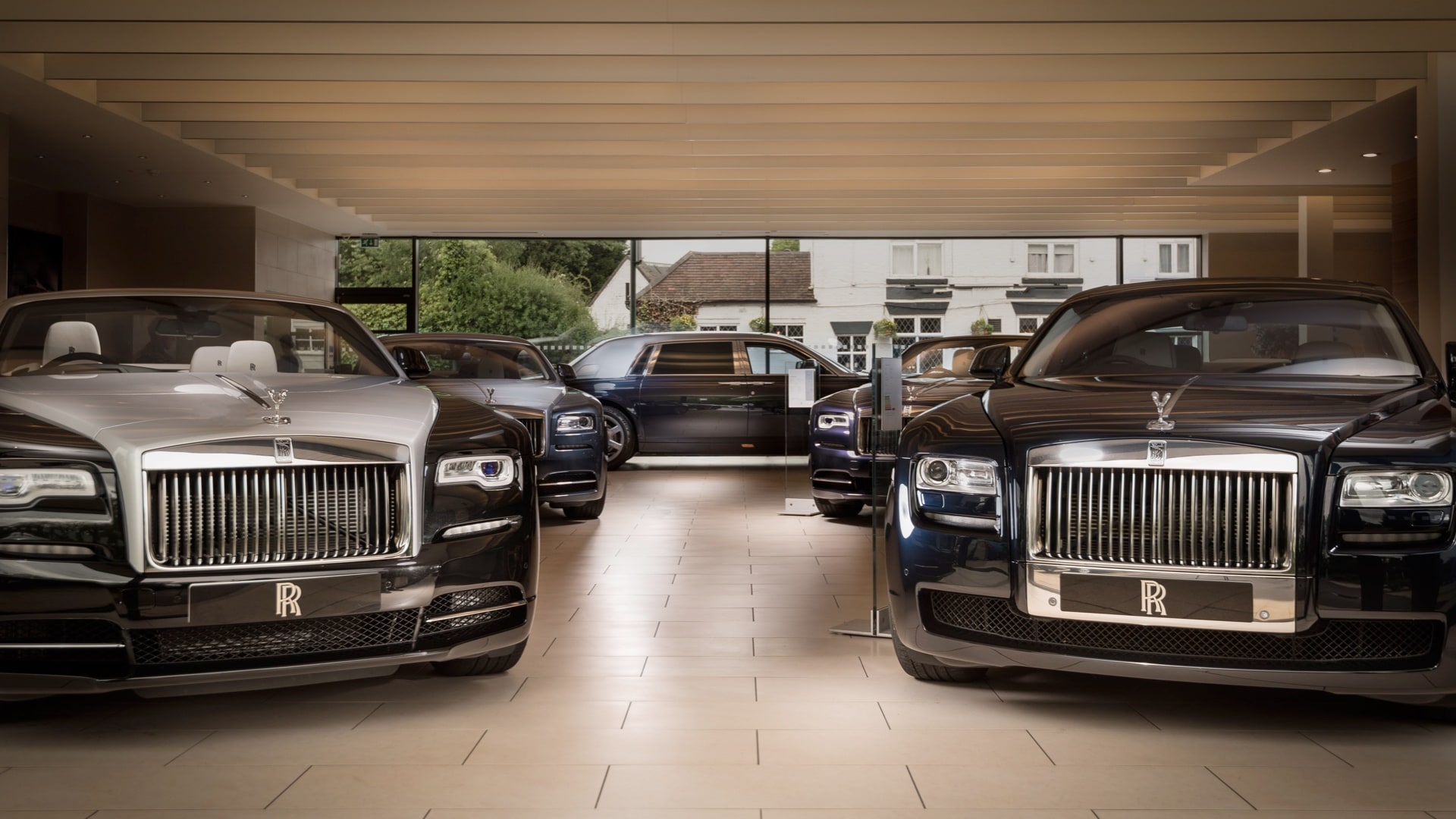Rolls-Royce showroom floor after handover, cars on display under a finished ceiling