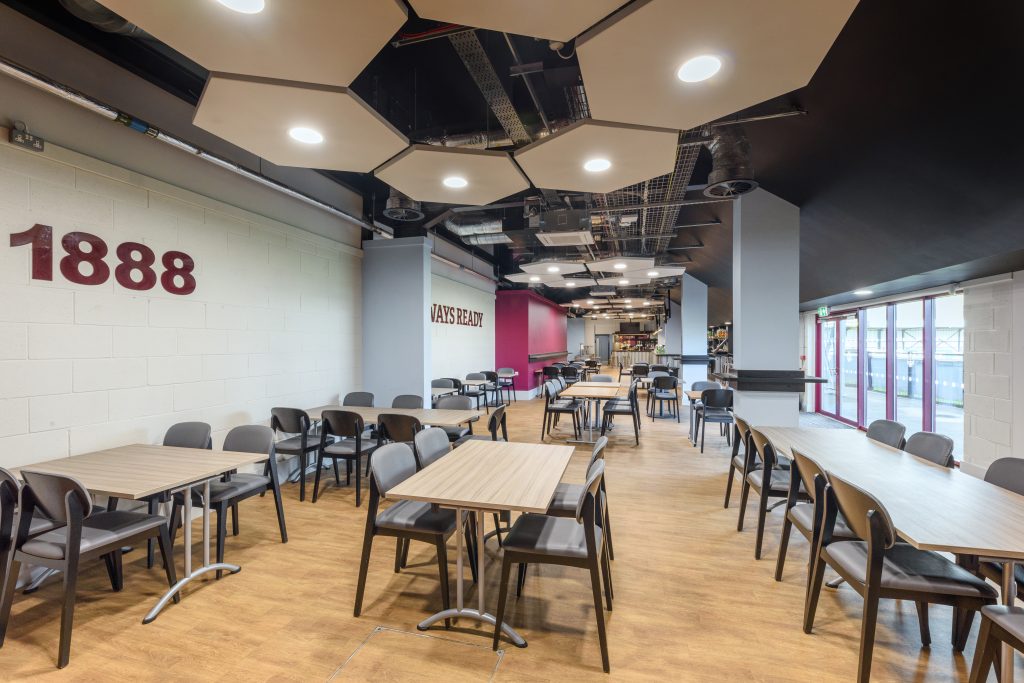 Feature ceiling rafts and lighting over the club's restaurant seating