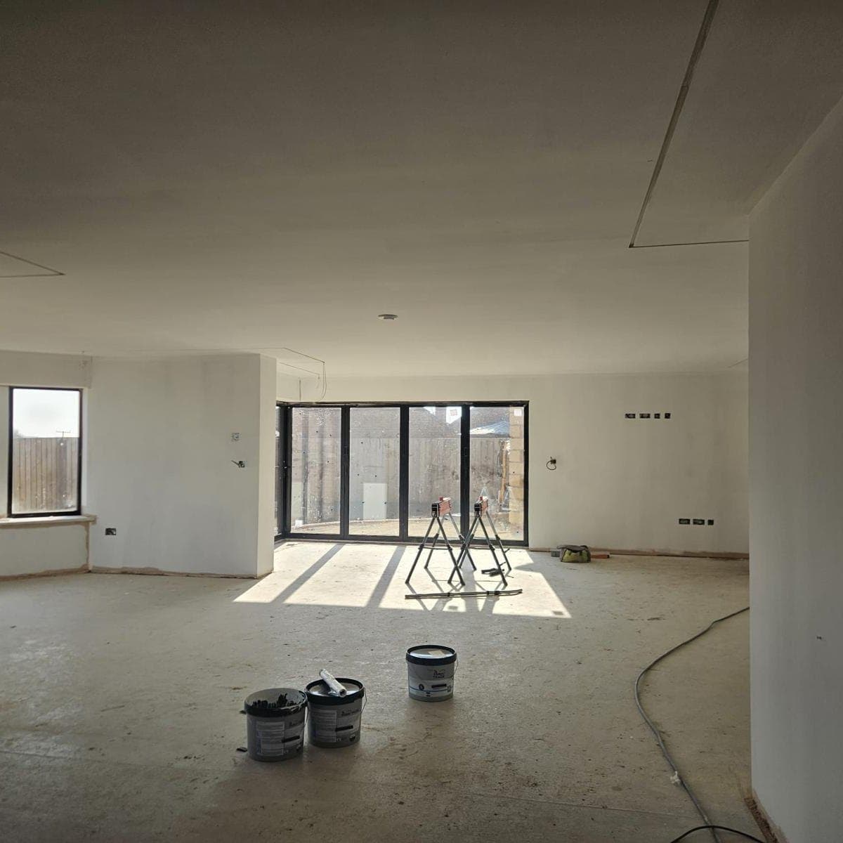 Open plan new build living space boarded and skimmed ahead of second fix